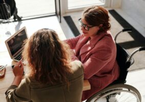 Two people looking to see what qualifies as a disability under the ADA