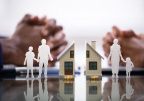 paper doll wife and husband splitting children and house after they hire a family lawyer